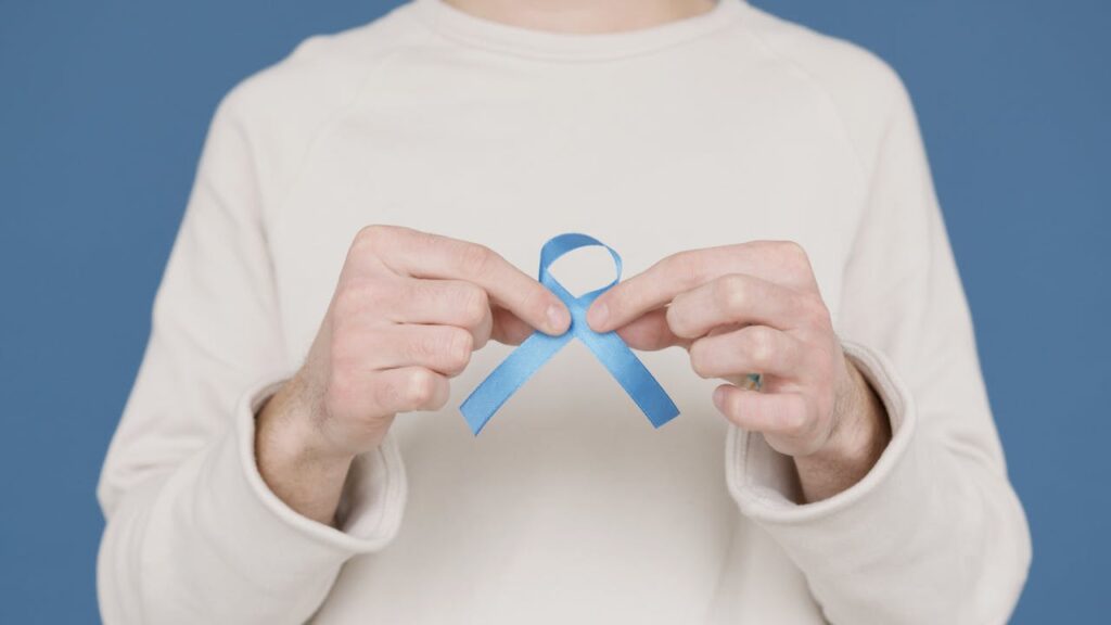 Person holding Blue Ribbon